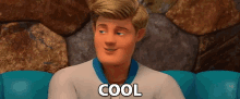 a cartoon man is sitting on a blue couch with the word cool written on his face