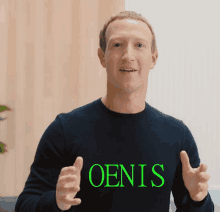 a man wearing a black shirt that says oensis