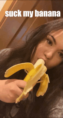 a woman is eating a banana with the words suck my banana above her