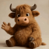 a stuffed cow with horns is waving its hand