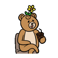 a teddy bear with a flower on its head is holding a cup