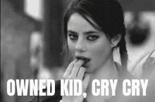 a black and white photo of a woman with the words " owned kid cry cry " below her