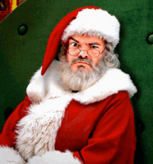 a man dressed as santa claus has a beard and glasses on