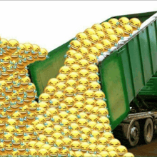a dumpster filled with lots of laughing emojis .