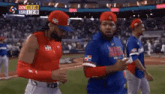 a group of baseball players are running on the field
