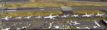 a bunch of airplanes are parked on the runway