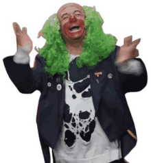 a man dressed as a clown with green wig and red nose