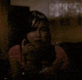 a woman talking on a cell phone with the words " it 's coming from inside the house " below her