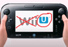 a person is holding a wii u game controller with a red circle around the wii u logo