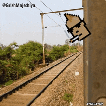 a pixel art of a man smoking a cigarette on a railroad track