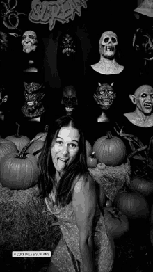 a woman sticking her tongue out in front of pumpkins and a sign for cocktails & screams