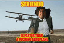 a man in a suit and tie is running from a plane that is flying in the background