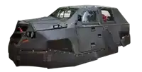 a black vehicle with a warning sign on the side of it