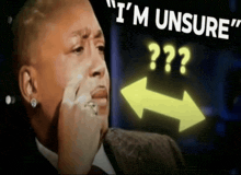 a man covering his face with his hand and the words " i 'm unsure "