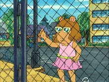 a cartoon character wearing sunglasses stands behind a fence