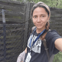 a woman wearing a lanyard with a name tag that says ' a.f.c.t. ' on it