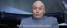 a bald man is sitting in a chair with the words ten thousand dollars behind him