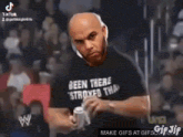 a bald man is wearing a shirt that says been there twice