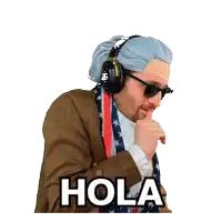 a man wearing a wig and sunglasses says hola with his hand