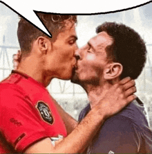 two men are kissing each other with a speech bubble in the background .