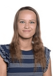 a woman wearing a blue and white striped shirt is smiling for the camera .