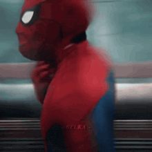 a blurry picture of a man in a spiderman suit
