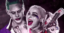 the joker and harley quinn pose for a photo