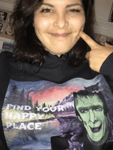 a woman is wearing a sweatshirt that says find your happy place