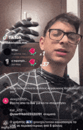 a man wearing glasses and a spider man costume is on a tiktok video