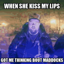 a man with glasses and a hat says when she kiss my lips got me thinking bout maddocks