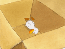 a cartoon duck is laying on its back on a cardboard box