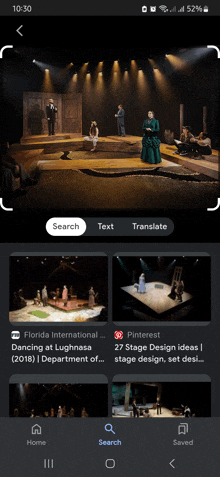 a phone screen shows a picture of a stage with a search button