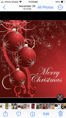 a phone screen shows a merry christmas message