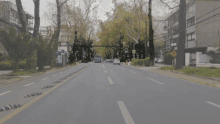 an empty street with a yellow sign that says ' atencion '