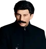 a man with a mustache is wearing a black suit