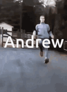 a man is running down a street with the name andrew on the bottom