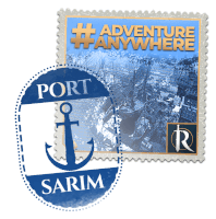 a postage stamp that says adventure anywhere and port sarım