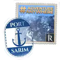 a postage stamp that says adventure anywhere and port sarım