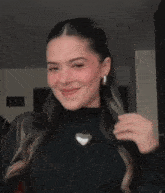 a blurry picture of a woman wearing a black sweater