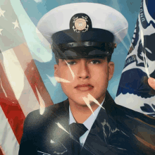 a man in a navy uniform is standing in front of a flag