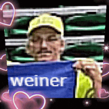 a man is holding a sign that says weiner on it