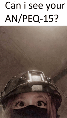 a woman wearing a mask and a helmet with the words can i see your an / peq-15