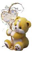 a yellow teddy bear with the letter a.c. on its head holds a heart