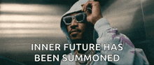 a man wearing sunglasses and a hoodie has the words inner future has been summoned above him