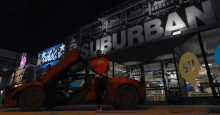 a man in a red shirt is sitting in front of a suburban store