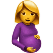 a pregnant woman is wearing a purple shirt and holding her belly .