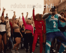 a group of people are dancing with the words rdubs made chili written above them