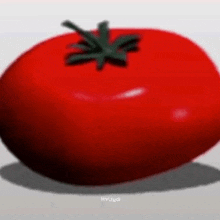 a red tomato with a green stem is on a white surface .