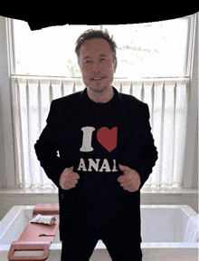 a man wearing a shirt that says i heart anal