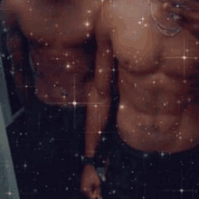 two shirtless men are taking a selfie in a bathroom mirror .